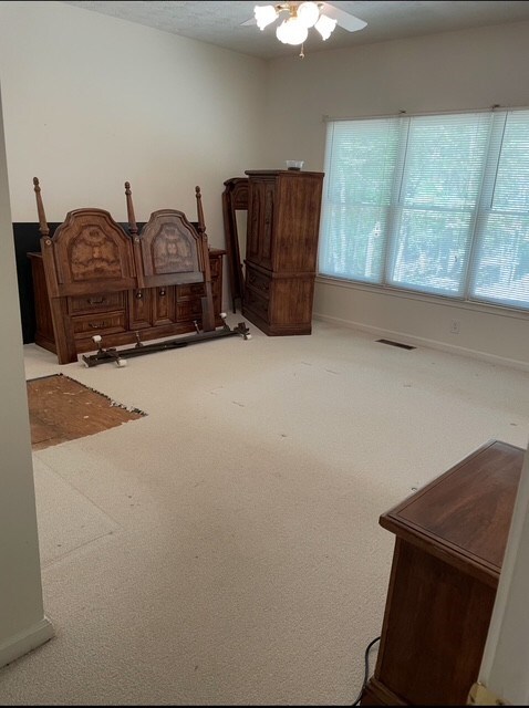 629 Camp Branch Rd, Ellijay, GA 30540 - carpeted bedroom featuring ceiling fan and baseboards