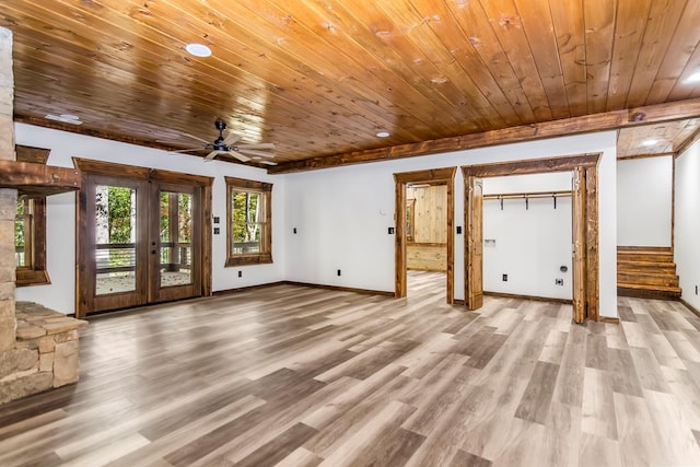 unfurnished living room with ceiling fan, light wood-type flooring, wooden ceiling, and french doors