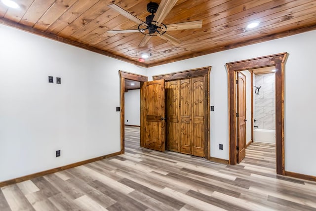 unfurnished bedroom with ceiling fan, wooden ceiling, connected bathroom, and light hardwood / wood-style flooring