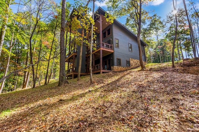 back of property featuring a wooden deck