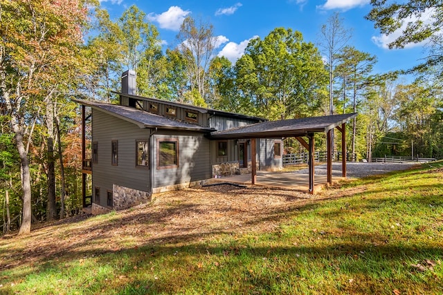 exterior space with a front yard and a patio