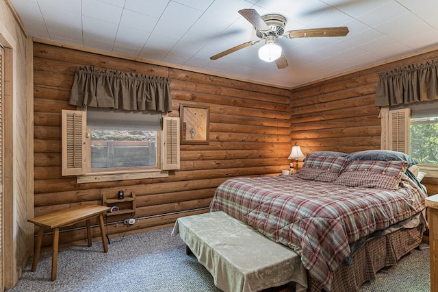 carpeted bedroom with log walls