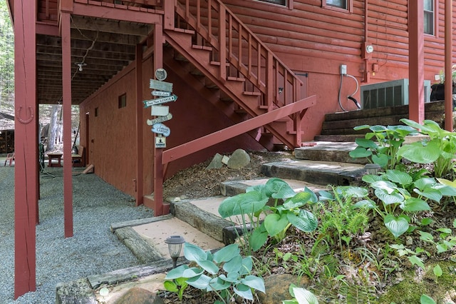 view of side of home with faux log siding