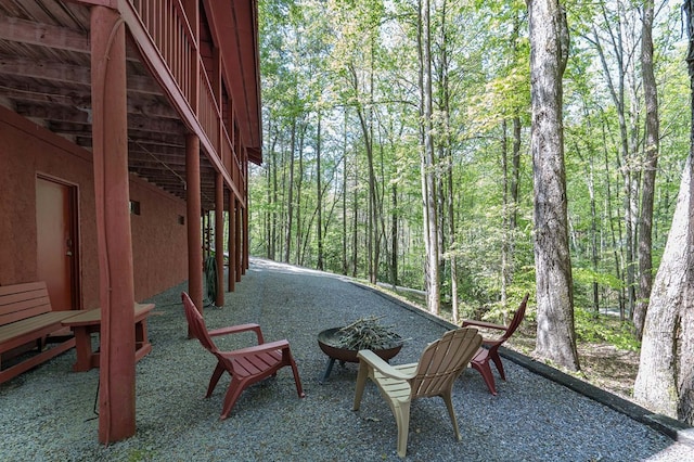 view of patio / terrace with a forest view