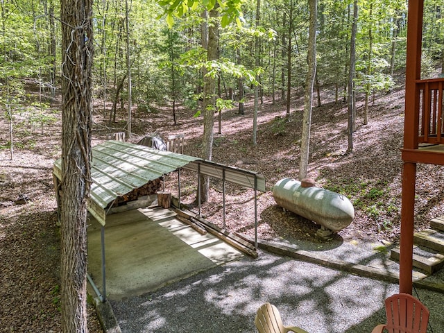 view of yard with a view of trees