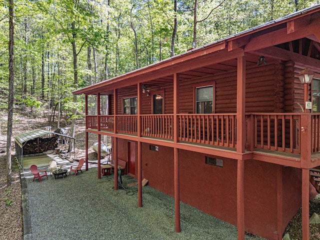 view of side of home featuring log exterior