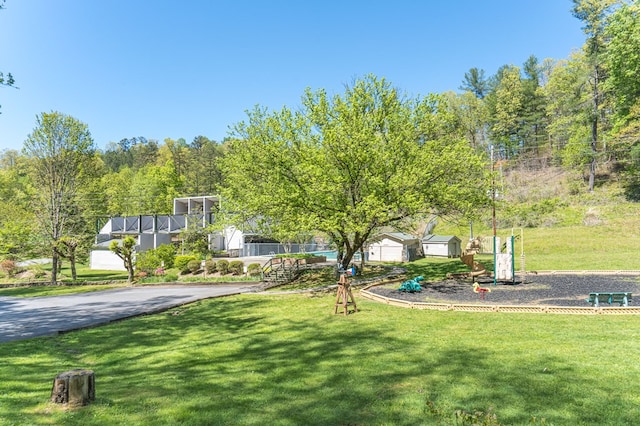 view of community featuring a lawn