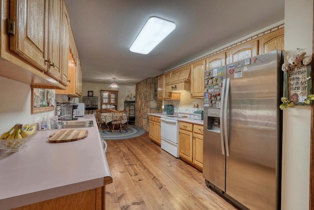 kitchen with stainless steel fridge with ice dispenser, light brown cabinetry, light hardwood / wood-style flooring, and white range with electric stovetop