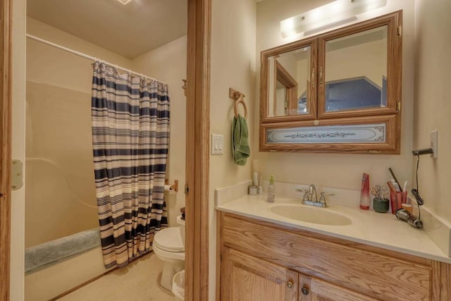 bathroom featuring a shower with shower curtain, toilet, and vanity