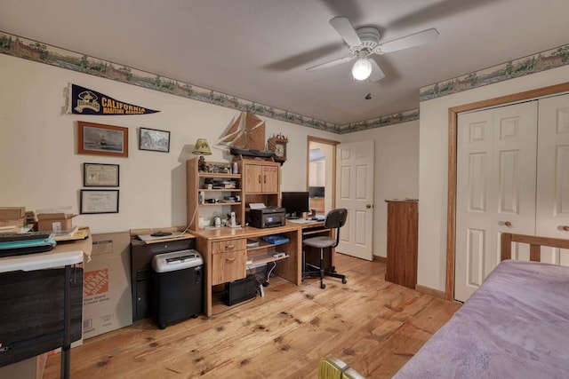 office space featuring ceiling fan and light hardwood / wood-style floors