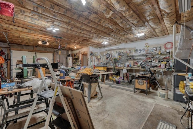 garage with a workshop area and a garage door opener