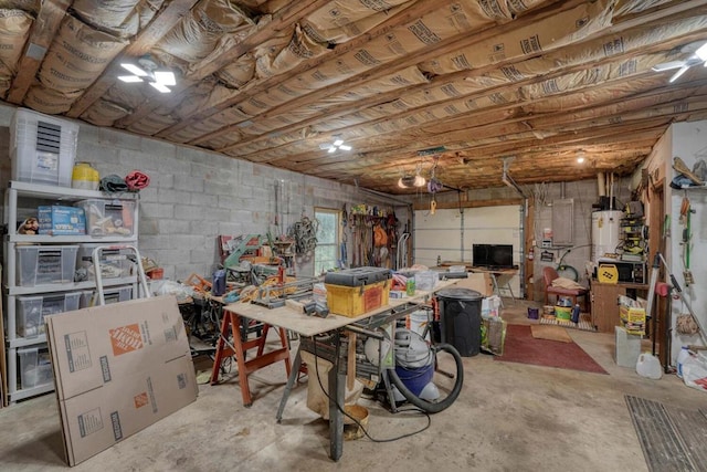 basement with gas water heater and a workshop area