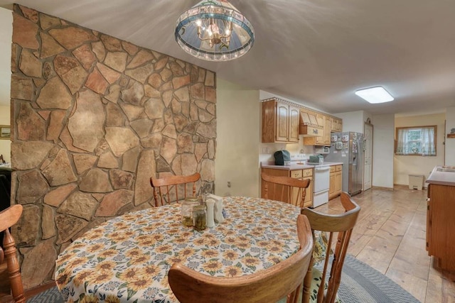 dining area featuring an inviting chandelier