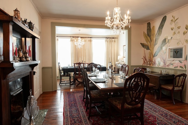 477 W First St, Blue Ridge, GA 30513 - dining room with a chandelier, wainscoting, wood-type flooring, crown molding, and a fireplace with flush hearth