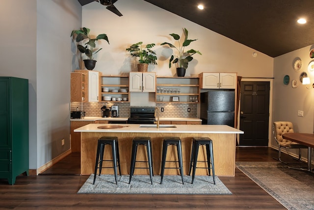 477 W First St, Blue Ridge, GA 30513 - kitchen with open shelves, black appliances, a breakfast bar area, backsplash, and high vaulted ceiling
