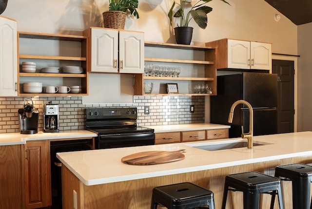477 W First St, Blue Ridge, GA 30513 - kitchen featuring black appliances, open shelves, tasteful backsplash, a kitchen bar, and lofted ceiling