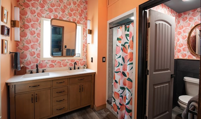 477 W First St, Blue Ridge, GA 30513 - full bath featuring wallpapered walls, double vanity, wood finished floors, and a shower with shower curtain