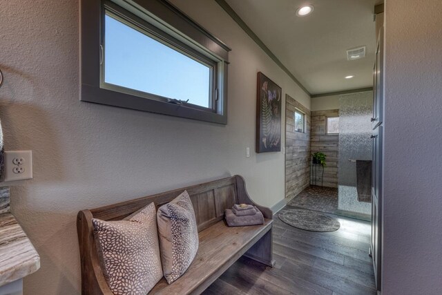 interior space featuring dark wood-type flooring and crown molding