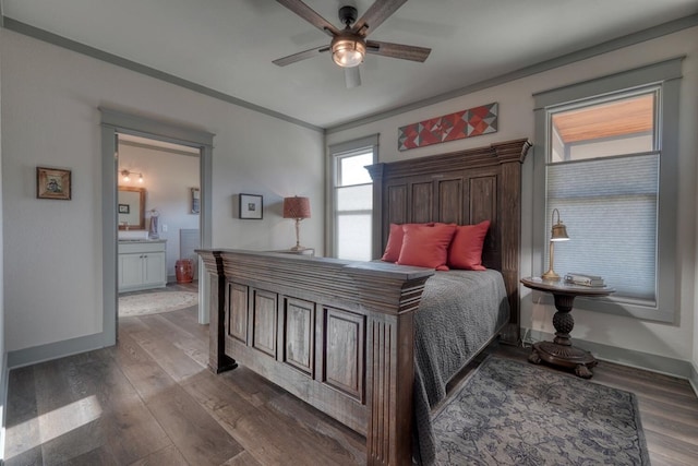 bedroom with ornamental molding, dark hardwood / wood-style floors, connected bathroom, and ceiling fan