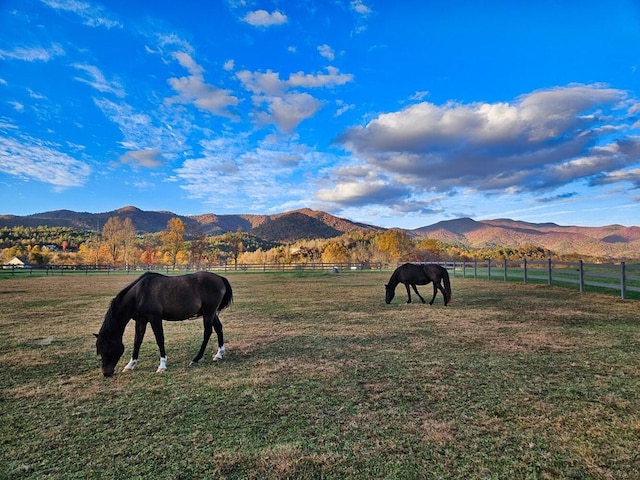 mountain view featuring a rural view