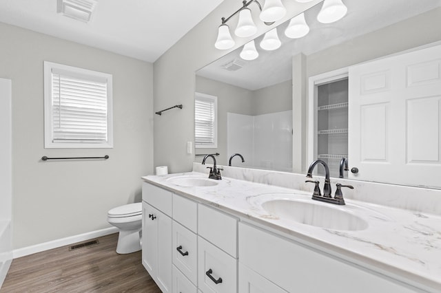full bathroom with visible vents and a sink