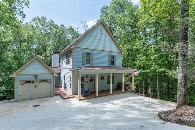 249 Whispering Pine Trl, Murphy, NC 28906 - view of front of property with covered porch, a detached garage, and concrete driveway