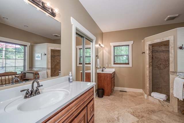 249 Whispering Pine Trl, Murphy, NC 28906 - full bath featuring healthy amount of natural light, two vanities, a walk in shower, and baseboards