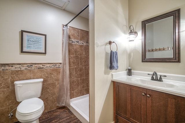 249 Whispering Pine Trl, Murphy, NC 28906 - bathroom with tile walls, toilet, vanity, a tile shower, and a wainscoted wall
