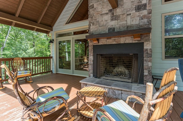 249 Whispering Pine Trl, Murphy, NC 28906 - wooden terrace with an outdoor stone fireplace