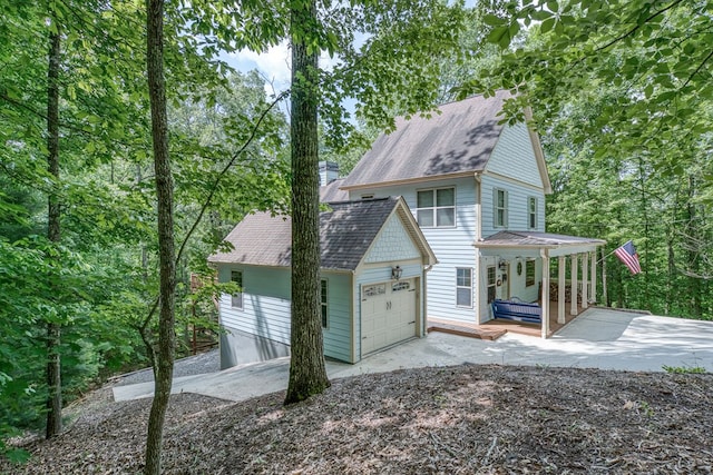 249 Whispering Pine Trl, Murphy, NC 28906 - view of front of property with a garage, concrete driveway, covered porch, and roof with shingles