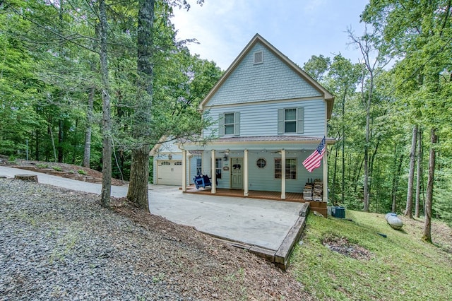 249 Whispering Pine Trl, Murphy, NC 28906 - rear view of house featuring covered porch, cooling unit, and a garage