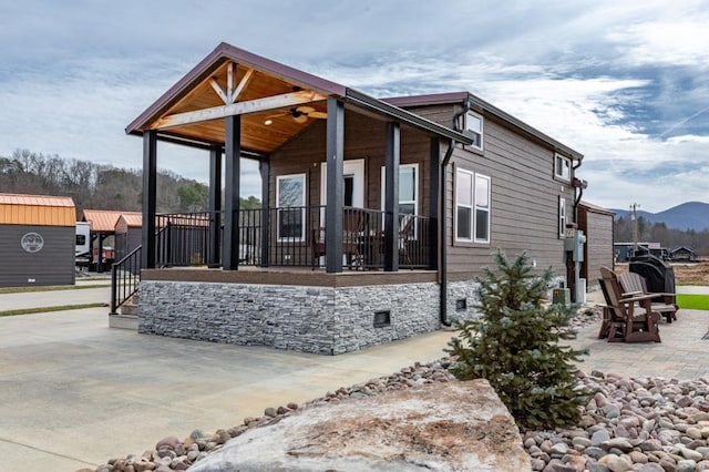 exterior space featuring a patio area and a mountain view