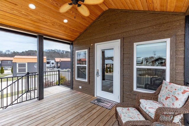 wooden deck featuring ceiling fan