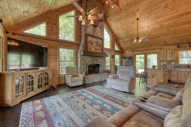living area featuring ceiling fan, track lighting, wood ceiling, and high vaulted ceiling