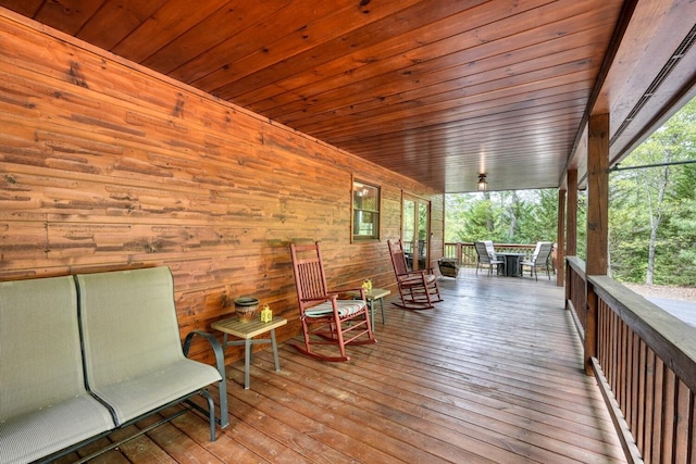 wooden deck featuring outdoor dining space