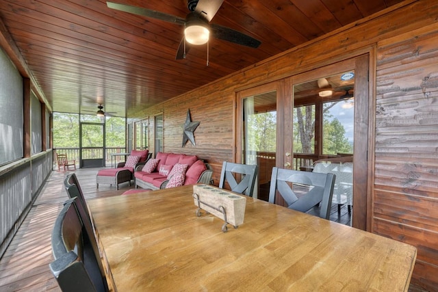 sunroom with ceiling fan and outdoor lounge area