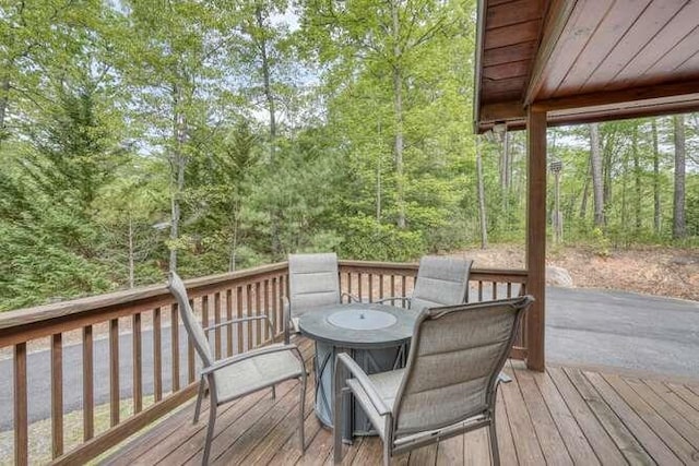deck featuring a view of trees