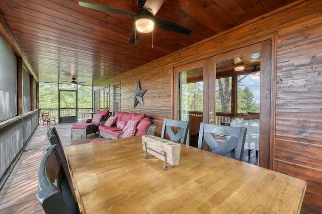 sunroom with ceiling fan and outdoor lounge area