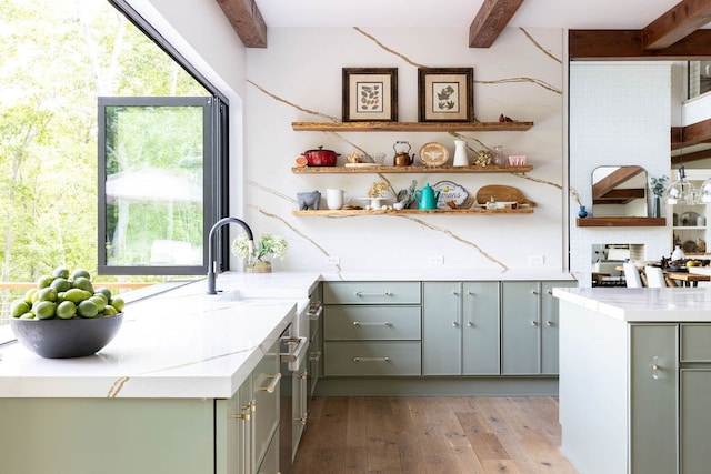 kitchen with sink, light hardwood / wood-style floors, decorative backsplash, and beamed ceiling