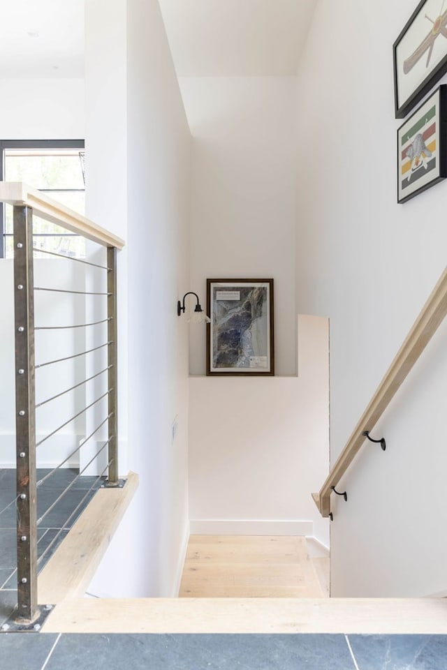 stairway with wood-type flooring