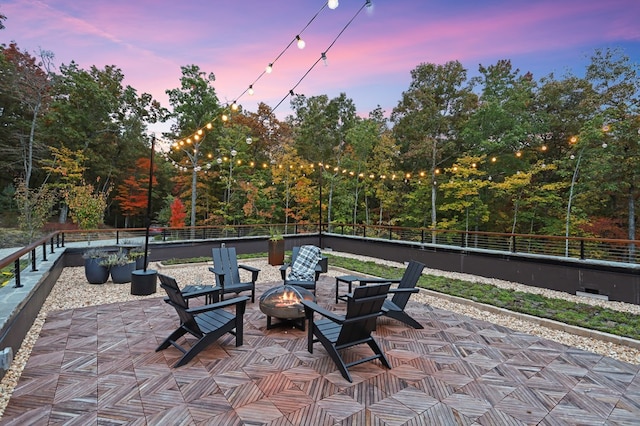 patio terrace at dusk with a fire pit