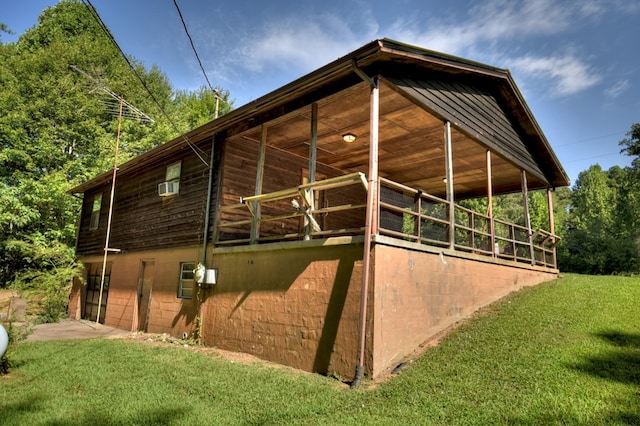 view of side of property featuring an outbuilding and an exterior structure