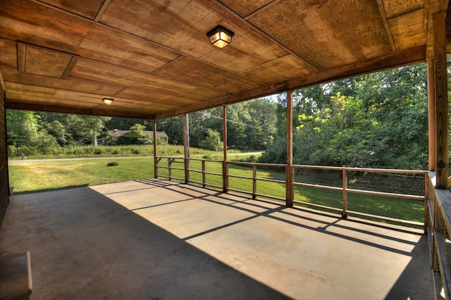 unfurnished sunroom featuring wood ceiling