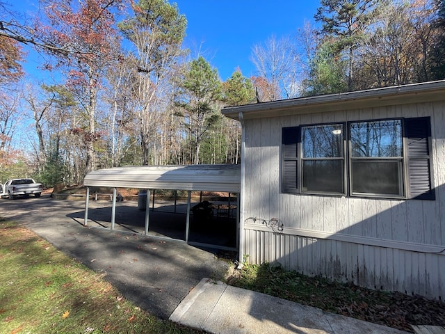 view of side of property featuring a carport