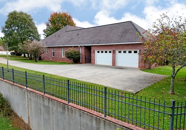 view of front facade with a front lawn and a garage