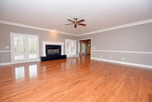 1507 Cedar View Ln, Hiawassee, GA 30546 - unfurnished living room featuring a ceiling fan, french doors, baseboards, ornamental molding, and light wood-style flooring