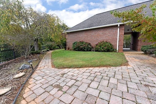 view of home's exterior featuring a yard