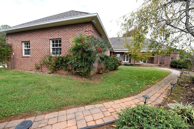 view of property exterior featuring a yard