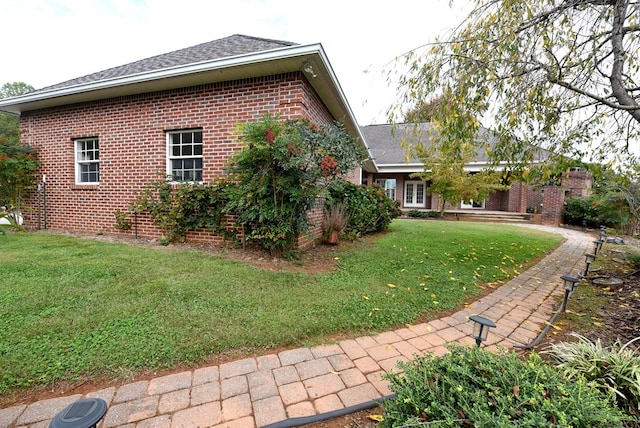 1507 Cedar View Ln, Hiawassee, GA 30546 - view of side of property with roof with shingles, a yard, and brick siding