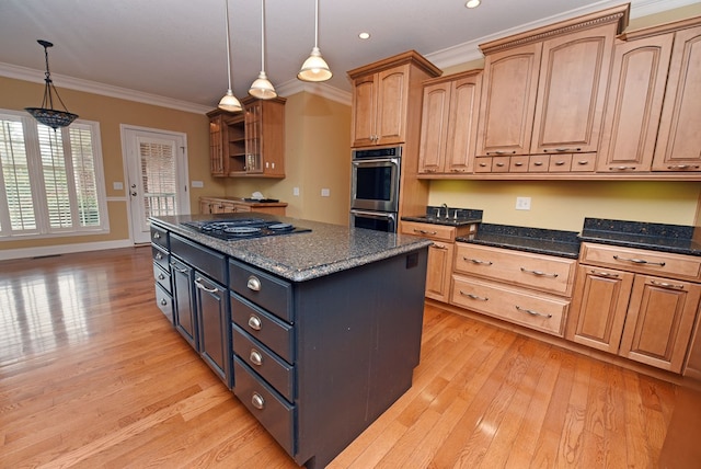 kitchen with hanging light fixtures, stainless steel double oven, black gas stovetop, and dark stone countertops